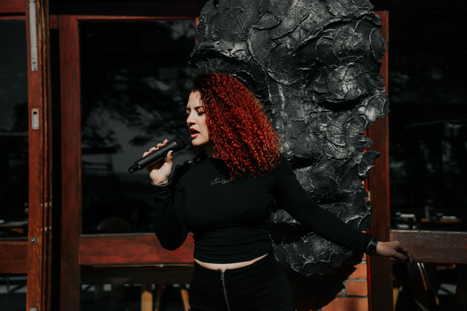 Rene Hunter singing in profile